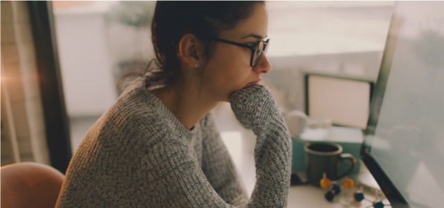 Woman looking at a computer