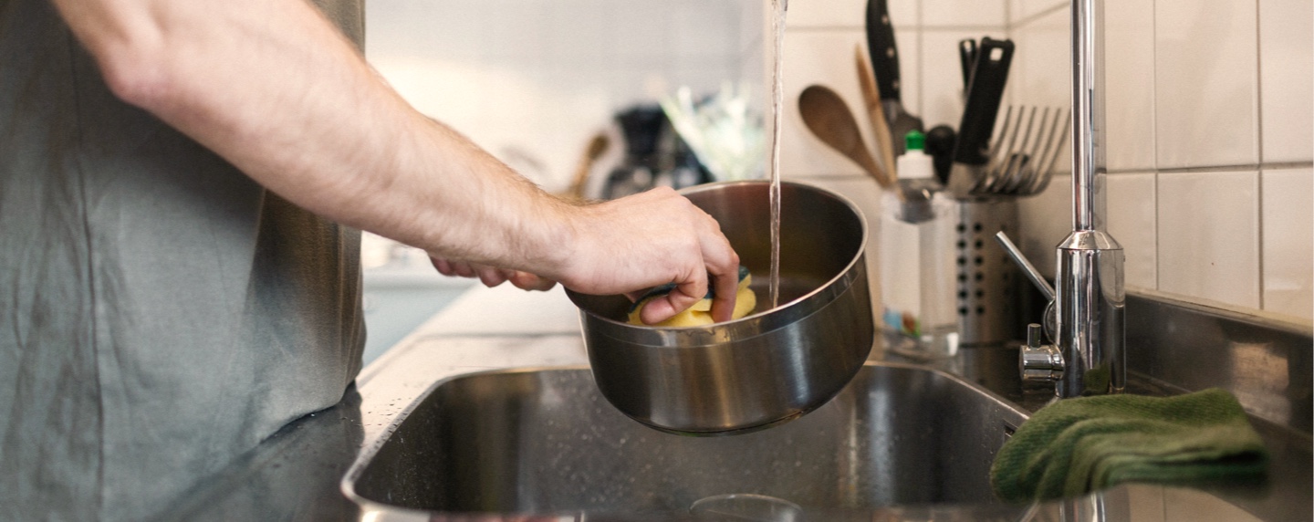 Symptoms of Huntington's disease chorea can complicate everyday tasks, like washing dishes.