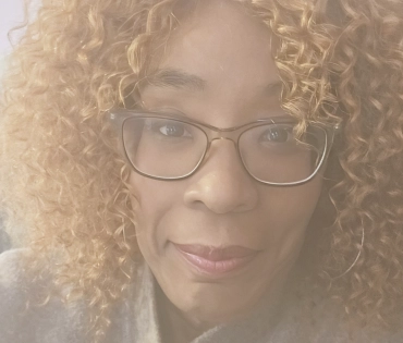 Tanita A., a patient living with Huntington's disease (HD) who has become an author and HD awareness speaker. 
