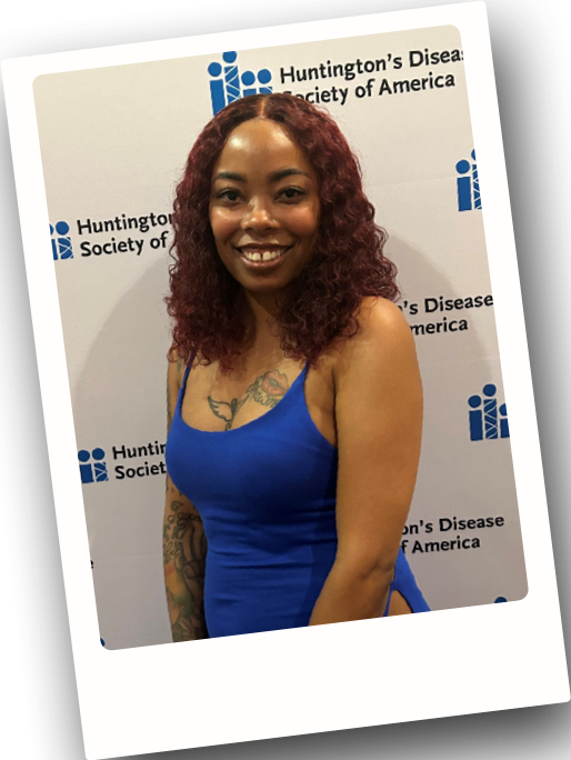 Rashawnda standing and smiling at a Huntington’s Disease (HD) Society of America event.
